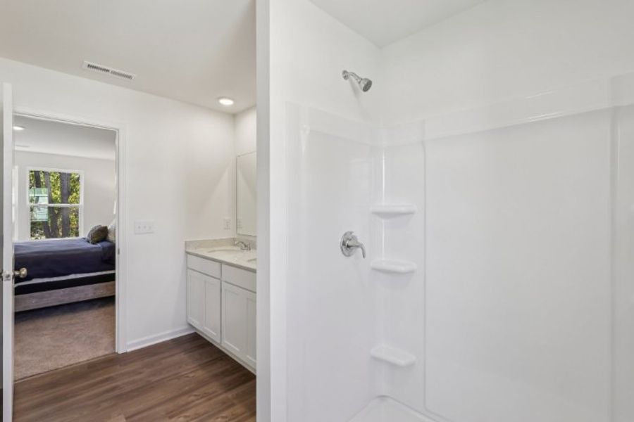 A bathroom with a glass shower.