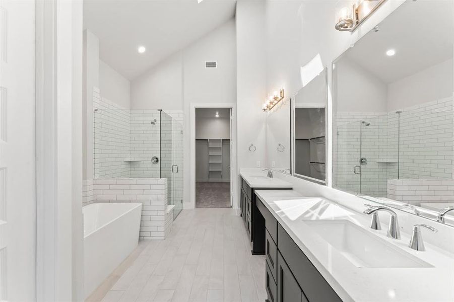 Gorgeous Primary Bath with Double Sinks, Vanity Area, Separate Shower, Freestanding Tub, Enclosed Toilet, Linen Closet, and Skylight!