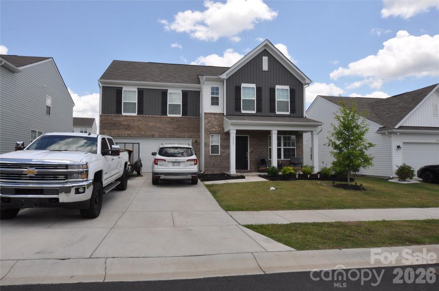 Front exterior of a new home in Walkers Mill, Edgemoor, SC, highlighting curb appeal (Image 2). Front exterior of a new home in Walkers Mill, Edgemoor, SC, highlighting curb appeal (Image 2).