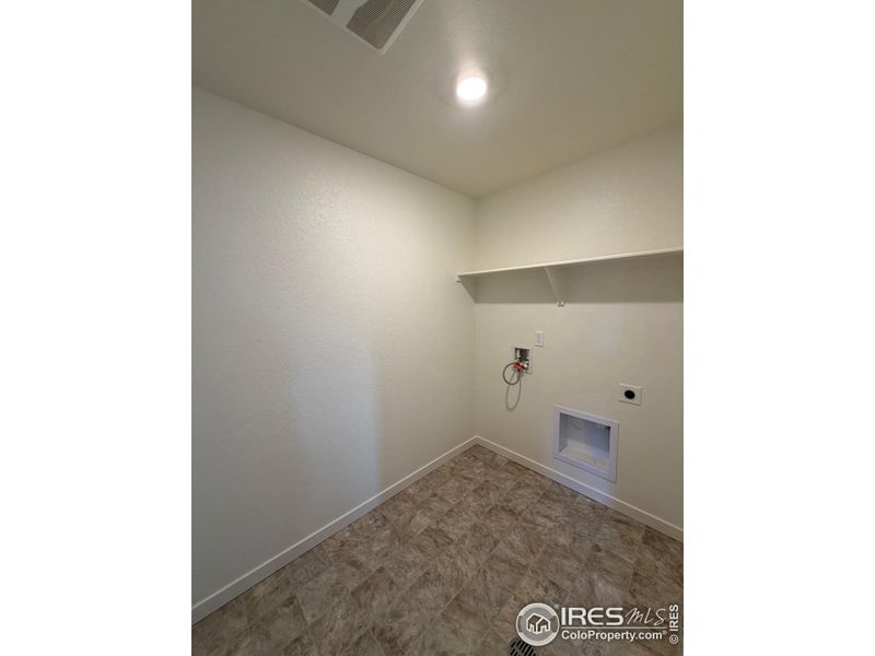 Laundry room on upper level Laundry room on upper level