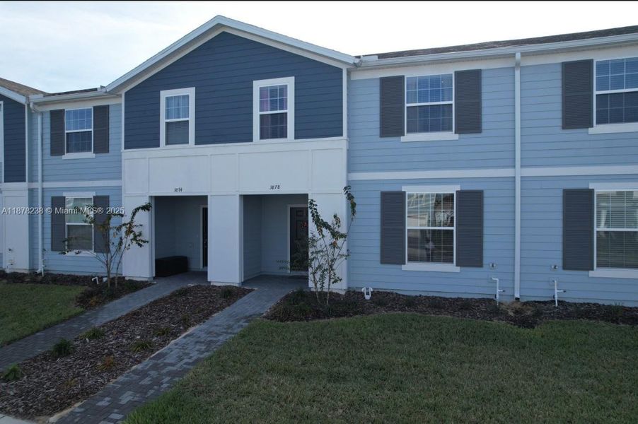 Front exterior of a new home in , Davenport, FL, highlighting curb appeal (Image 22).