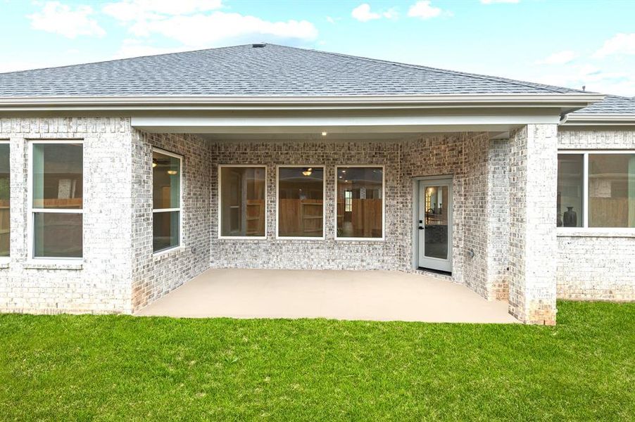 Large covered patio at rear of home