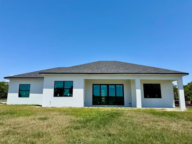 Front exterior of a new home in , Okeechobee, FL, highlighting curb appeal (Image 23).
