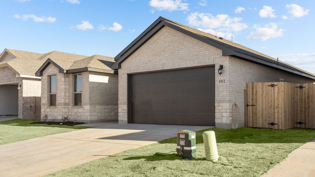 Representative exterior photo of a completed home built from the PORTALES by D.R. Horton in Northwest Passage, Midland, TX (Image 14). Representative exterior photo of a completed home built from the PORTALES by D.R. Horton in Northwest Passage, Midland, TX (Image 14).