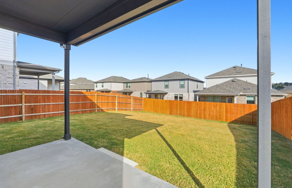 Exterior details and patio area of a home in Saddleback at Santa Rita Ranch, Liberty Hill (Image 21).