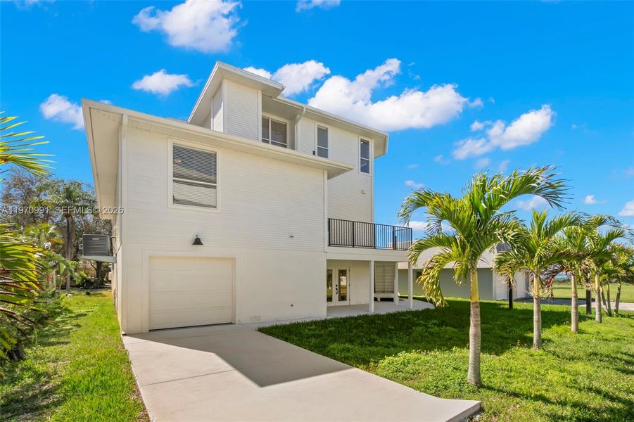 Front exterior of a new home in , Crystal Beach, FL, highlighting curb appeal (Image 20).