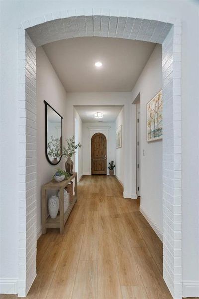 Hallway with light wood-style flooring and recessed lighting Hallway with light wood-style flooring and recessed lighting