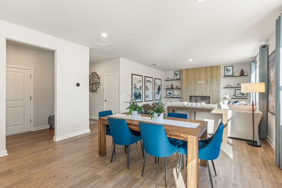 A dining room with a table and chairs. A dining room with a table and chairs.