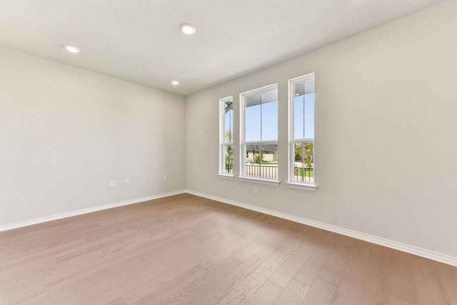 Empty room featuring recessed lighting and light wood-type flooring