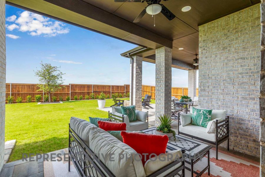 View of patio / terrace featuring a fenced backyard, an outdoor living space, outdoor dining space, and a ceiling fan View of patio / terrace featuring a fenced backyard, an outdoor living space, outdoor dining space, and a ceiling fan