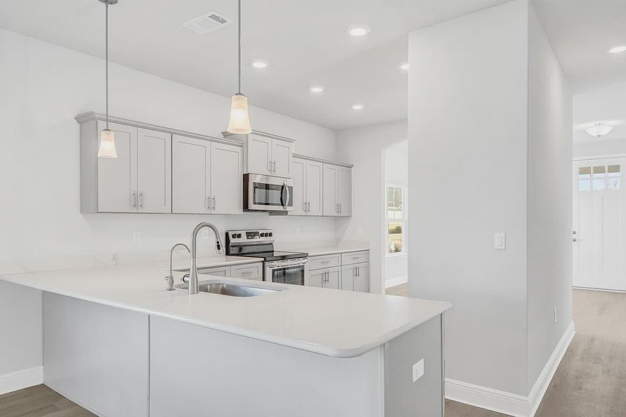 Furnished interior view inside a new home in The Bluffs at Lafayette, Freeport (Image 6).