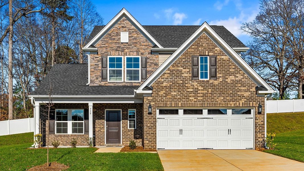 Front exterior of a new home in Hanes Lake, Winston-Salem, NC, highlighting curb appeal (Image 1).