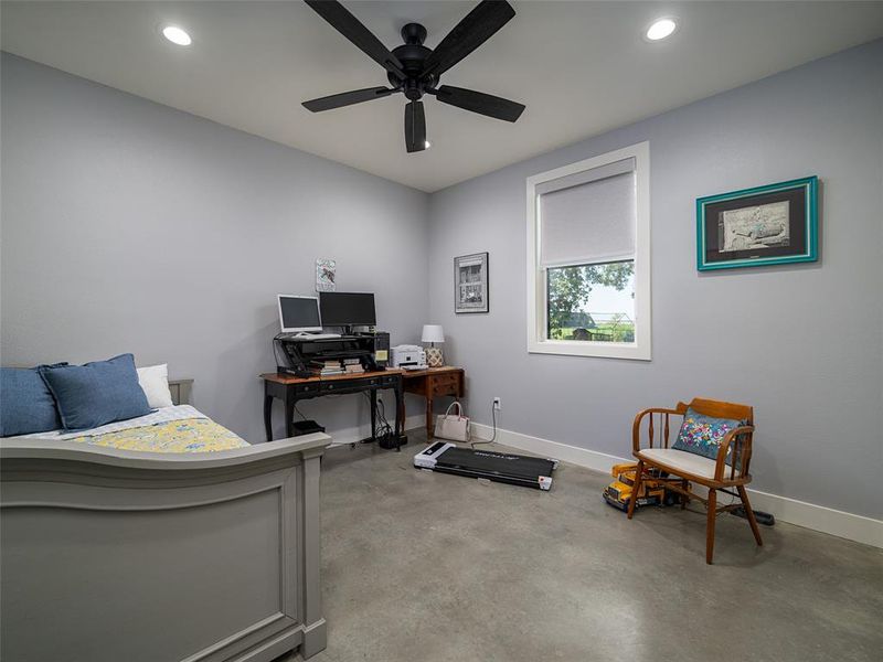 Office space with finished concrete floors, recessed lighting, and a ceiling fan Office space with finished concrete floors, recessed lighting, and a ceiling fan