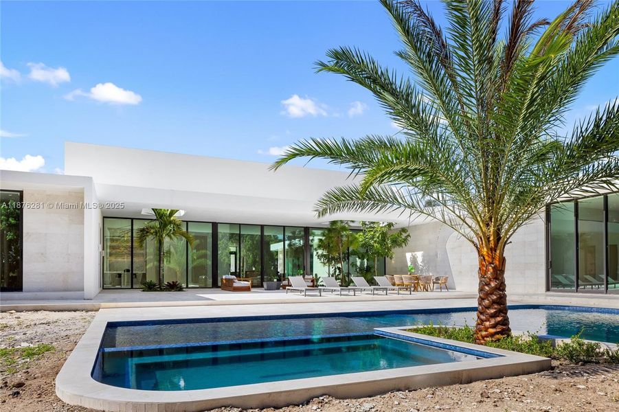 Front exterior of a new home in , Southwest Ranches, FL, highlighting curb appeal (Image 1).