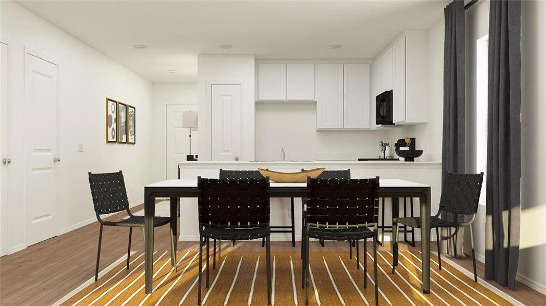 Kitchen featuring white cabinetry and wood-type flooring