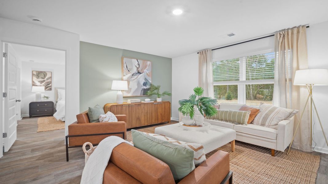 Representative furnished interior of a home built from the Freeport by D.R. Horton in Palm Ridge, Guyton (Image 9).