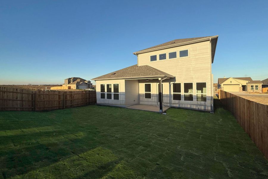 Back of house featuring a patio area and a fenced backyard