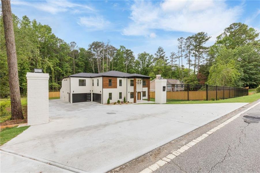 Front exterior of a new home in , Lilburn, GA, highlighting curb appeal (Image 28).