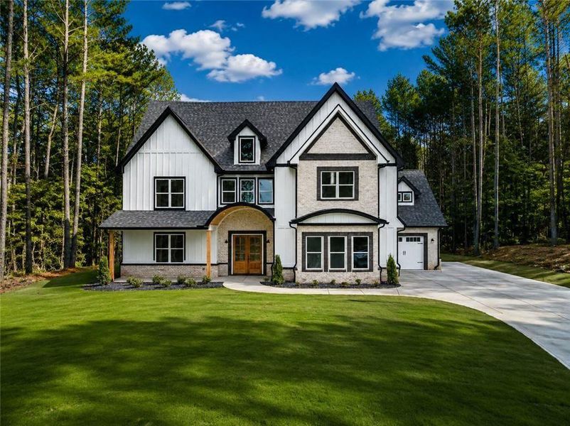 Front exterior of a new home in , Winder, GA, highlighting curb appeal (Image 1). Front exterior of a new home in , Winder, GA, highlighting curb appeal (Image 1).