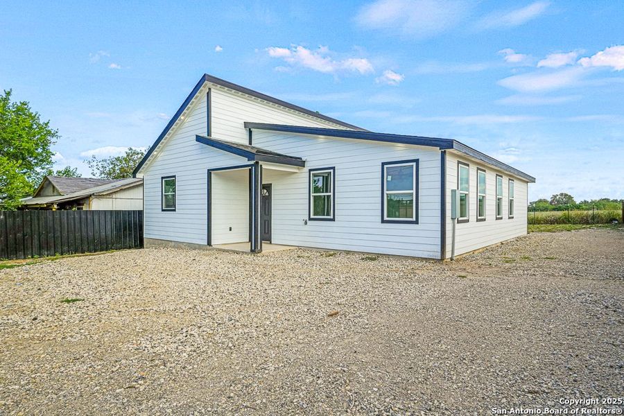 Front exterior of a new home in , Von Ormy, TX, highlighting curb appeal (Image 14). Front exterior of a new home in , Von Ormy, TX, highlighting curb appeal (Image 14).