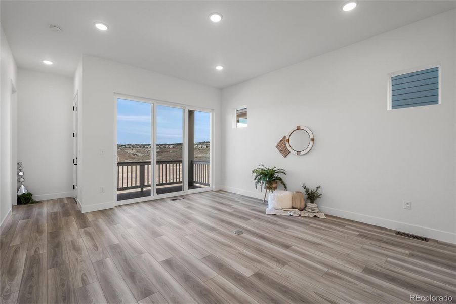Spacious, unfurnished interior of a new home in Revel Crossing at Wolf Ranch - The Panorama Collection, Colorado Springs (Image 23).