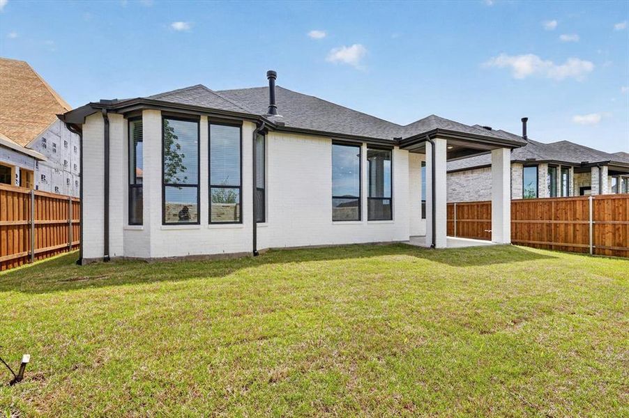 Exterior details and patio area of a home in Trinity Falls, McKinney (Image 3).