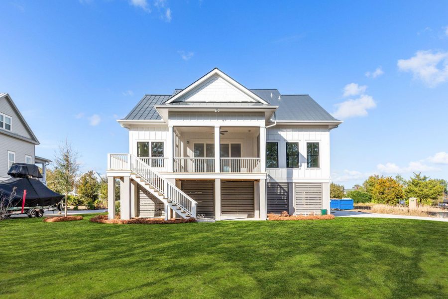 Exterior details and patio area of a home in Rivercroft, Awendaw (Image 31).