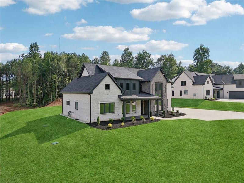 Front exterior of a new home in , Braselton, GA, highlighting curb appeal (Image 40).