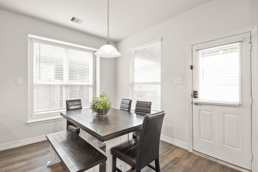 A generous size breakfast room can easily accommodate a 6 person table.