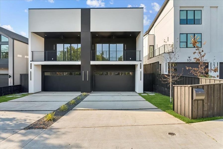 Contemporary house with a garage and a balcony