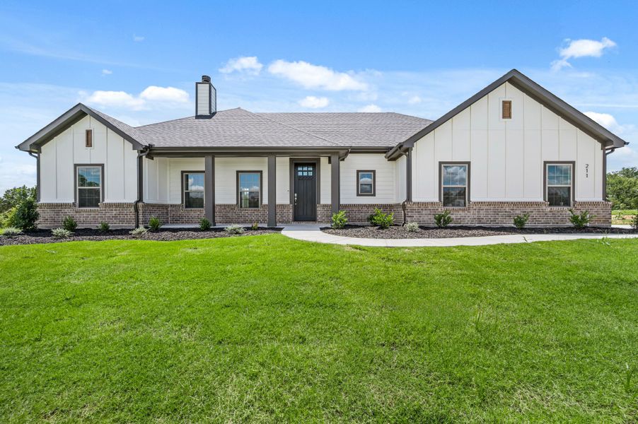 Front exterior of a new home in Saddleback Estates, Boyd, TX, highlighting curb appeal (Image 19).
