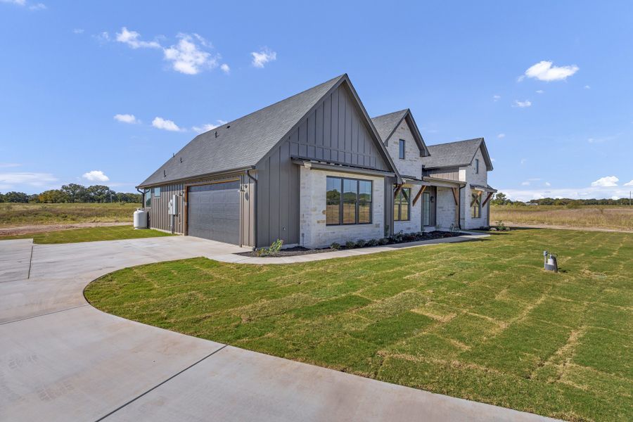 Front exterior of a new home in Oak Water Ranch, Granbury, TX, highlighting curb appeal (Image 29).