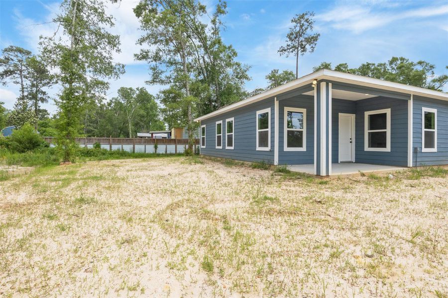 Exterior details and patio area of a home in , Splendora (Image 20).