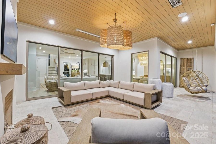 Outdoor oversized covered porch area is perfect for entertaining. Just open up the stacked sliding glass doors to the Great Room or the sliding glass door to the Breakfast area. Fun outdoor swing seating with waterfront views makes this a great place to hang out. Outdoor oversized covered porch area is perfect for entertaining. Just open up the stacked sliding glass doors to the Great Room or the sliding glass door to the Breakfast area. Fun outdoor swing seating with waterfront views makes this a great place to hang out.