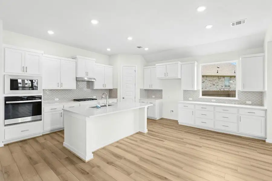 Furnished interior view inside a new home in The Colony, Bastrop (Image 9).