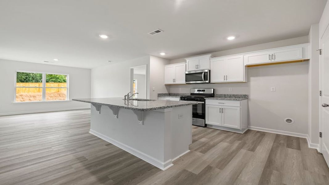Furnished interior view inside a new home in Bentley Park, Greenwood (Image 6).