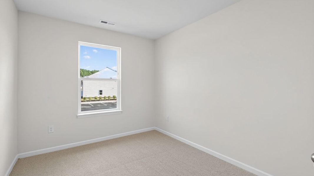 Spacious, unfurnished interior of a new home in The Townes at Honeycutt Oaks, Angier (Image 24).