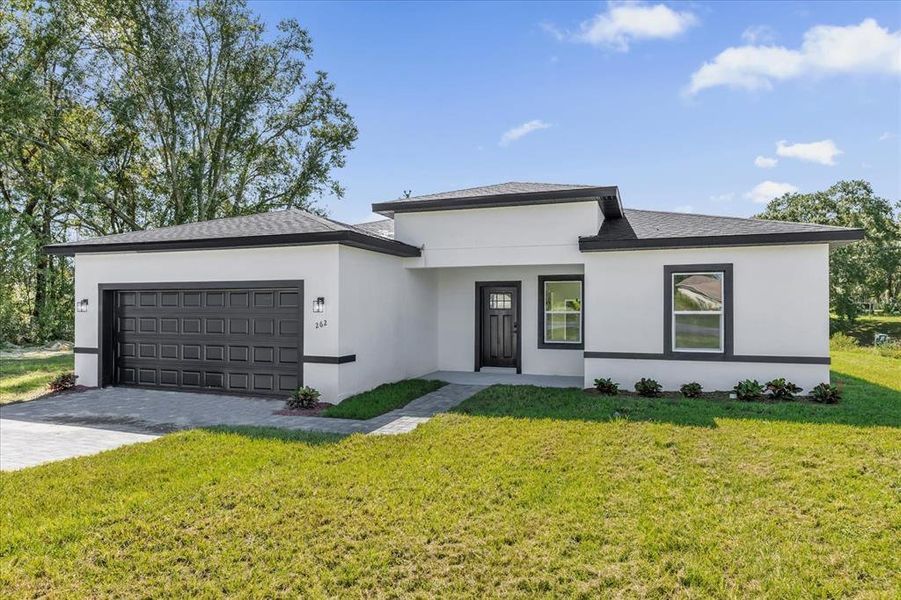Front exterior of a new home in , Ocala, FL, highlighting curb appeal (Image 2).
