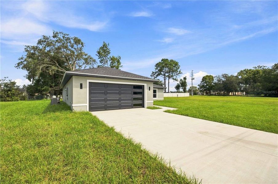 Front exterior of a new home in , Ocala, FL, highlighting curb appeal (Image 2). Front exterior of a new home in , Ocala, FL, highlighting curb appeal (Image 2).