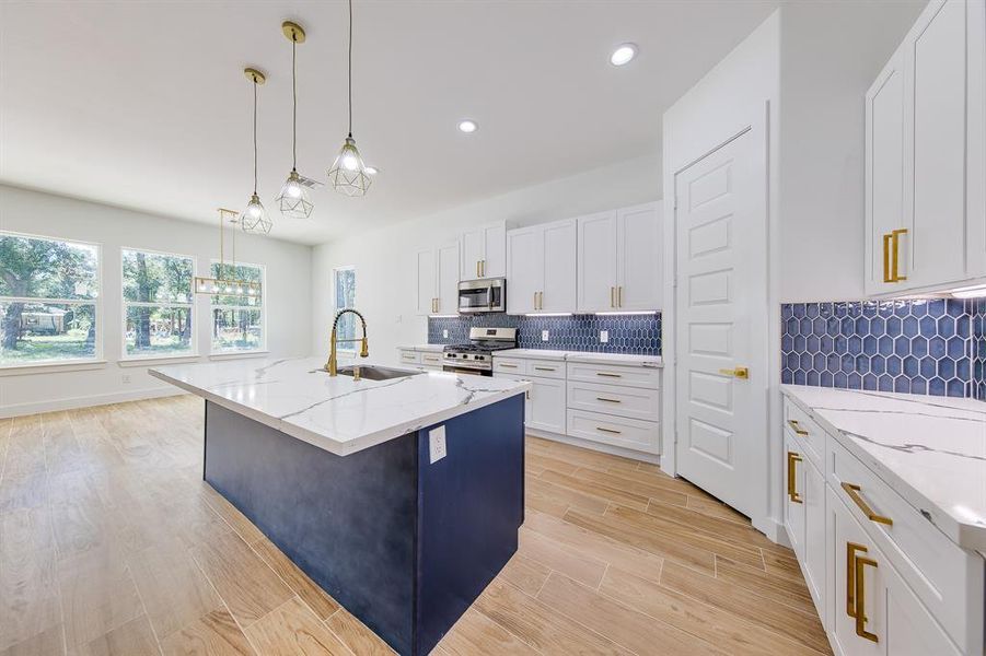 Welcome to your dream kitchen, where spaciousness meets functionality! With plenty of room to move around, this kitchen invites you to whip up your favorite meals while entertaining friends and family.