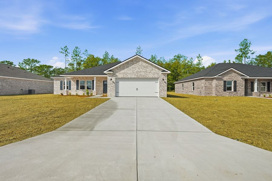 Front exterior of a new home in Southern Charm, Crestview, FL, highlighting curb appeal (Image 22).