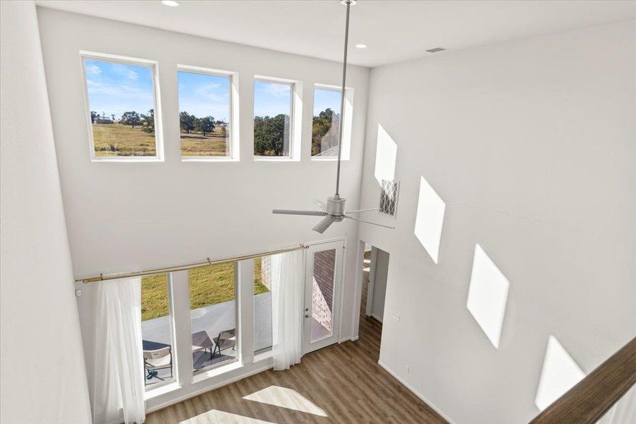 Detailed view of wood finished floors, ceiling fan, and recessed lighting Detailed view of wood finished floors, ceiling fan, and recessed lighting