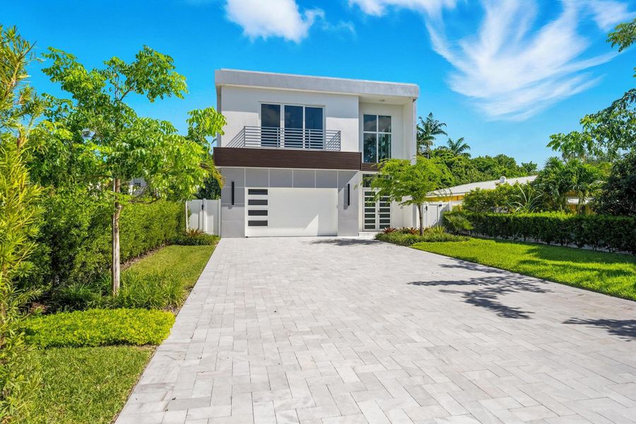 Front exterior of a new home in , Delray Beach, FL, highlighting curb appeal (Image 24). Front exterior of a new home in , Delray Beach, FL, highlighting curb appeal (Image 24).