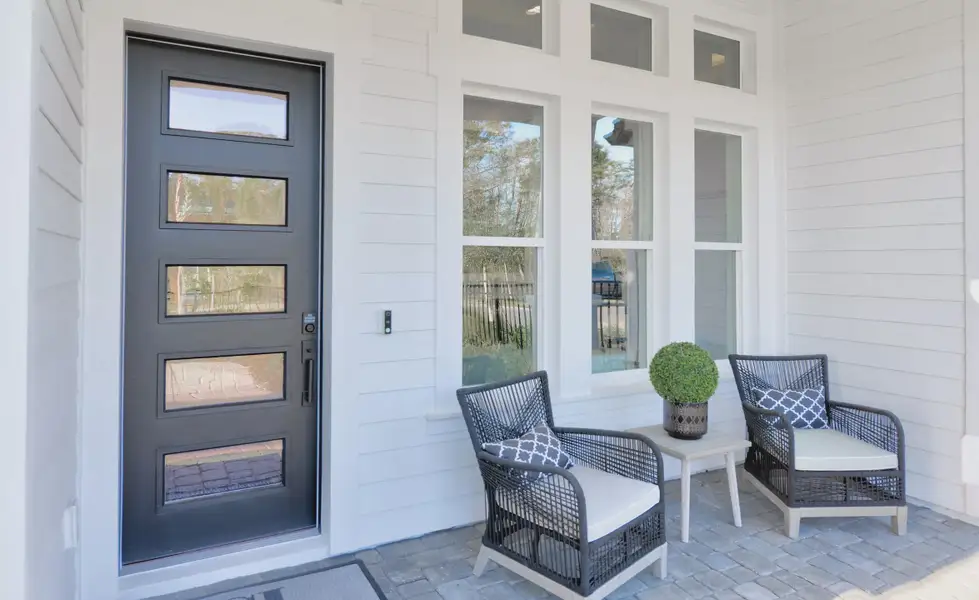 Exterior details and patio area of a home in Woodhaven, Port Orange (Image 2).