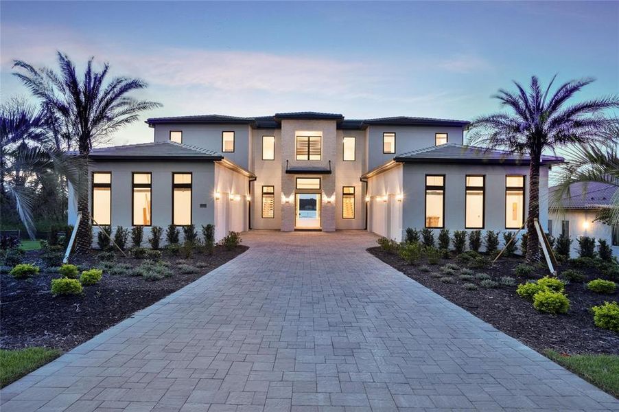 Front exterior of a new home in , Montverde, FL, highlighting curb appeal (Image 1). Front exterior of a new home in , Montverde, FL, highlighting curb appeal (Image 1).