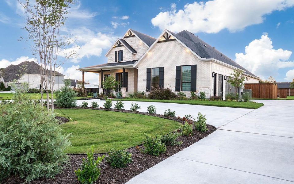 Front exterior of a new home in Marvida, Cypress, TX, highlighting curb appeal (Image 21).