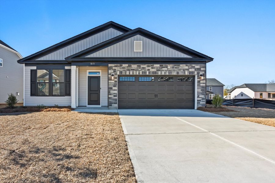 Front exterior of a new home in Portrait Hills, Aiken, SC, highlighting curb appeal (Image 1). Front exterior of a new home in Portrait Hills, Aiken, SC, highlighting curb appeal (Image 1).