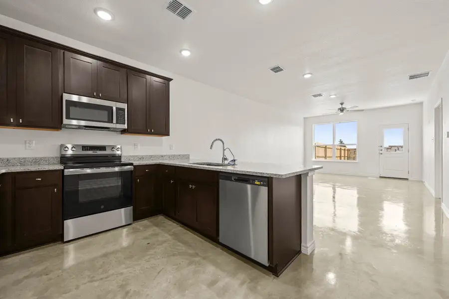 Furnished interior view inside a new home in The Preserve at Thousand Oaks Duplexes, Killeen (Image 4).