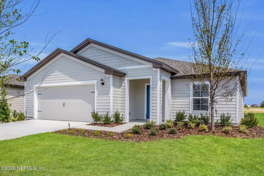 Front exterior of a new home in Westport Landing, Jacksonville, FL, highlighting curb appeal (Image 2). Front exterior of a new home in Westport Landing, Jacksonville, FL, highlighting curb appeal (Image 2).