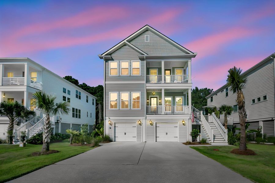 Front exterior of a new home in Overlook at Copahee Sound, Awendaw, SC, highlighting curb appeal (Image 23). Front exterior of a new home in Overlook at Copahee Sound, Awendaw, SC, highlighting curb appeal (Image 23).